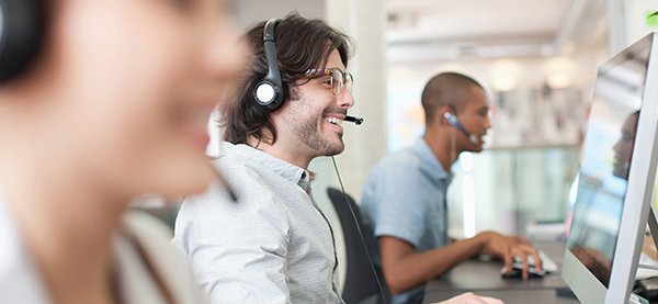 Two people conducting customer satisfaction survey over the phone