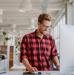 Marketing agency employee on computer