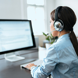 Email marketing agency employee working on computer